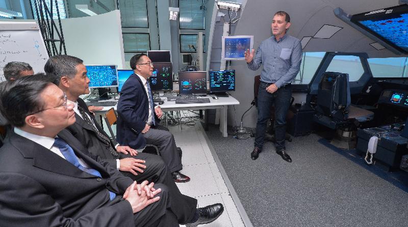 The Chief Executive, Mr C Y Leung (second left); the Secretary for Transport and Housing, Professor Anthony Cheung Bing-leung (first left); and the Secretary for Innovation and Technology, Mr Nicholas W Yang (third left), visit the pilot training simulator at Ecole Nationale de l'Aviation Civile (National School of Civil Aviation) in Toulouse, France, today (June 7, Toulouse time).